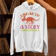 Unearth a Story Summer Reading 2026 Triceratops Dino Book Unisex Hoodie Unearth a Story Summer Reading 2026 Triceratops Dino Book Unisex Hoodie