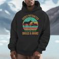 Easily Distracted By Dholes & Books Retro Wild Dogs Lover Men Hoodie