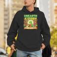 Unearth A Story Dinosaur Summer Reading 2026 Books Men Hoodie Unearth A Story Dinosaur Summer Reading 2026 Books Men Hoodie