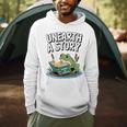 Unearth a Story Frog Reading a Book Summer 2026 Premium Tri-Blend Men Hoodie