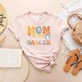 Mom Of The Birthday Baller Groovy Baseball Mom Women's Heather T-Shirt Heather Peach Mom Of The Birthday Baller Groovy Baseball Mom Women's Heather T-Shirt Heather Peach
