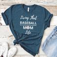 Living That Baseball Mom Life Women's Heather T-Shirt Heather Deep Teal Living That Baseball Mom Life Women's Heather T-Shirt Heather Deep Teal