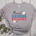 Busy Raising Ballers Retro Groovy Baseball Mom Outfit Women's Heather T-Shirt Athletic Heather Busy Raising Ballers Retro Groovy Baseball Mom Outfit Women's Heather T-Shirt Athletic Heather