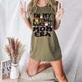 In My Softball Baseball Mom Era Retro Groovy Mom Of Both Women's Heather T-Shirt Heather Olive In My Softball Baseball Mom Era Retro Groovy Mom Of Both Women's Heather T-Shirt Heather Olive