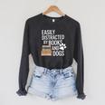 Books And Dogs Easily Distracted For Dog Mom Dog Dad Reader Raglan Sleeve Sweatshirt Dark Grey Heather