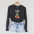 The Bookworm Gnome Christmas Gnome Book Reading Enthusiast Raglan Sleeve Sweatshirt Dark Grey Heather