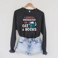 Easily Distracted By Cats And Books Cat & Book Lover For Men Women Kids Raglan Sleeve Sweatshirt Dark Grey Heather Easily Distracted By Cats And Books Cat & Book Lover For Men Women Kids Raglan Sleeve Sweatshirt Dark Grey Heather