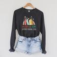 Unearth A Story Summer Reading 2026 Book Wildflowers Raglan Sleeve Sweatshirt Dark Grey Heather Unearth A Story Summer Reading 2026 Book Wildflowers Raglan Sleeve Sweatshirt Dark Grey Heather