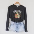 Unearth A Story Summer Reading 2026 Dinosaur Books Raglan Sleeve Sweatshirt Dark Grey Heather Unearth A Story Summer Reading 2026 Dinosaur Books Raglan Sleeve Sweatshirt Dark Grey Heather