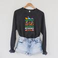 Unearth A Story Summer Reading Program 2026 Dinosaur Book Raglan Sleeve Sweatshirt Dark Grey Heather