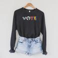 Vote Books Fist Ovaries LGTBQ Men Women Raglan Sleeve Sweatshirt Dark Grey Heather