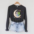 Women's Astronaut Reading Book With Alien Moon Space Astronomy Raglan Sleeve Sweatshirt Dark Grey Heather