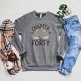 1986 Chapter Forty 40th Birthday Wildflower Book 40 Year Old Raglan Sleeve Sweatshirt Deep Heather 1986 Chapter Forty 40th Birthday Wildflower Book 40 Year Old Raglan Sleeve Sweatshirt Deep Heather