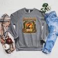 2026 Summer Reading Dinosaur Unearth A Story Book Lover Raglan Sleeve Sweatshirt Deep Heather