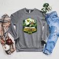2026 Summer Reading Unearth a Story Teachers Students Book Raglan Sleeve Sweatshirt Deep Heather