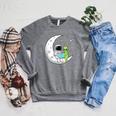 Astronaut And Alien Reading On Moon Space Book Lover Sci Fi Raglan Sleeve Sweatshirt Deep Heather