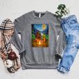 Bigfoot And Alien Reading Books Campfire Halloween Raglan Sleeve Sweatshirt Deep Heather