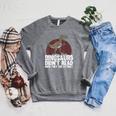 Cool Reading Teacher For Men Women Read Books Dinosaur Book Raglan Sleeve Sweatshirt Deep Heather