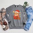 Cute Christmas Book Otter Reading Snowy Holiday Story Raglan Sleeve Sweatshirt Deep Heather