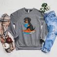 Dachshund Dog With Glasses Reading Book Librarian Raglan Sleeve Sweatshirt Deep Heather