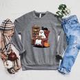 Ghost With Bookshelf Halloween Bookish Premium Tri-Blend Raglan Sleeve Sweatshirt Deep Heather