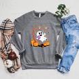 Ghost Reading Book On Swing Halloween Autumn Art Raglan Sleeve Sweatshirt Deep Heather