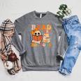Groovy Booooks Ghost Read More Books Teacher Halloween Men Women Kids Raglan Sleeve Sweatshirt Deep Heather