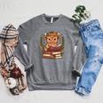 Highland Cow Reading Book Graphic Cow With Book Floral Raglan Sleeve Sweatshirt Deep Heather Highland Cow Reading Book Graphic Cow With Book Floral Raglan Sleeve Sweatshirt Deep Heather