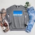 Kitch-Iti-Kipi MI Kitch-Iti-Kipi Palms Book Park Michigan Premium Tri-Blend Raglan Sleeve Sweatshirt Deep Heather