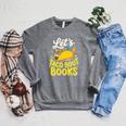 Let's Taco About Books Mexican Pun Bookworm Premium Tri-Blend Raglan Sleeve Sweatshirt Deep Heather