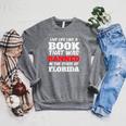Live Life Like A Book Banned In The State Of Florida Raglan Sleeve Sweatshirt Deep Heather Live Life Like A Book Banned In The State Of Florida Raglan Sleeve Sweatshirt Deep Heather