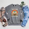 Take A Look It In A Book Retro Rainbow Reading Teacher Raglan Sleeve Sweatshirt Deep Heather