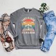 Take a Look It’s In a Book Vintage Sunset Mountain Reading Raglan Sleeve Sweatshirt Deep Heather Take a Look It’s In a Book Vintage Sunset Mountain Reading Raglan Sleeve Sweatshirt Deep Heather