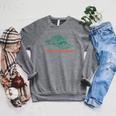 The Plot Thickens Bookish Raccoon Fantasy Book Reader Raglan Sleeve Sweatshirt Deep Heather