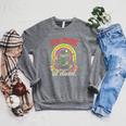 We Read At Dawn Frog Grimoire Book Raglan Sleeve Sweatshirt Deep Heather