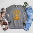 A Well Read Woman Is A Dangerous Creature Book Witch Raglan Sleeve Sweatshirt Deep Heather
