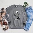 The Reader Tarot Card Skeleton Reading Book Books Raglan Sleeve Sweatshirt Deep Heather
