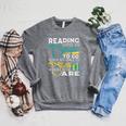Reading Gives Us Someplace To Go Book Lover Teacher Bookworm Men Women Kids Raglan Sleeve Sweatshirt Deep Heather Reading Gives Us Someplace To Go Book Lover Teacher Bookworm Men Women Kids Raglan Sleeve Sweatshirt Deep Heather