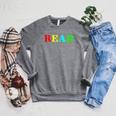 Teacher Reading Read In Color Book Raglan Sleeve Sweatshirt Deep Heather