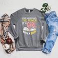 Never Underestimate Bookworm Girl Book Reader Reading Raglan Sleeve Sweatshirt Deep Heather