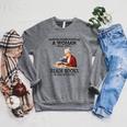 Never Underestimate A Woman Who Still Reads Books In Her Raglan Sleeve Sweatshirt Deep Heather