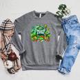 Unearth a Story Library Summer Reading 2026 Dinosaur Book Raglan Sleeve Sweatshirt Deep Heather
