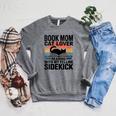 Women's Book Mom Cat Lover Reading With My Felline Sidekick Raglan Sleeve Sweatshirt Deep Heather