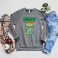 Women's Unearth a Story Summer Reading 2026 Triceratops Dino Book Raglan Sleeve Sweatshirt Deep Heather Women's Unearth a Story Summer Reading 2026 Triceratops Dino Book Raglan Sleeve Sweatshirt Deep Heather