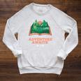 Adventure Awaits a Idea For Book Lovers Raglan Sleeve Sweatshirt Heather Mustard