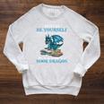 Always Be Yourself Unless You Can Be A Book Dragon Books Raglan Sleeve Sweatshirt Heather Mustard