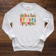 ASL American Sign Language Reads Books Stays Weird Raglan Sleeve Sweatshirt Heather Mustard ASL American Sign Language Reads Books Stays Weird Raglan Sleeve Sweatshirt Heather Mustard