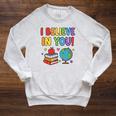 I Believe In You Educational Art With Books And Globe Raglan Sleeve Sweatshirt Heather Mustard