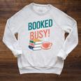 Booked And Busy Cool Coffee Reading Relaxing Books Raglan Sleeve Sweatshirt Heather Mustard Booked And Busy Cool Coffee Reading Relaxing Books Raglan Sleeve Sweatshirt Heather Mustard