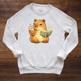 Capybara Reading a Book With Bubble Tea Raglan Sleeve Sweatshirt Heather Mustard